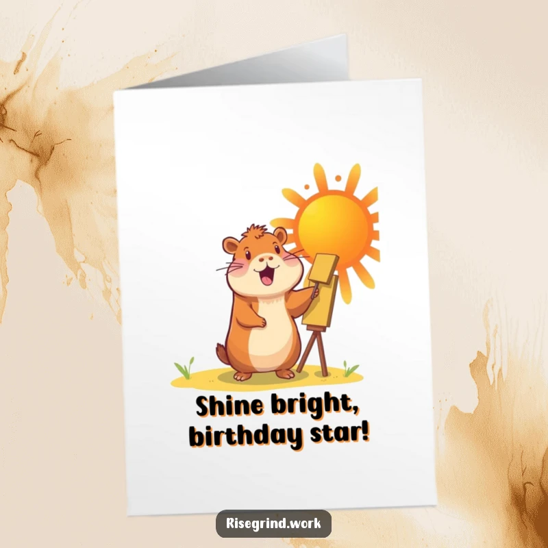 Funny Free Printable Birthday Card: A cheerful capybara enthusiastically paints a giant, vibrant sun, spreading warmth and joy.